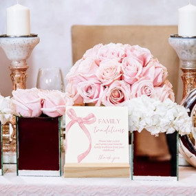 ANIANG Family Tradition Baby Shower Games Sign, Baby Shower Sign, Pink Bow Childhood Memory Wood Plaque, Babyshower Game Wooden Plaque with Wood Stand for Babyshower Decorations, 4X4 Inch